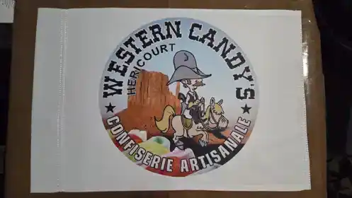 Custom marine-grade printed flag made for Western Candy's, an artisan candy shop in Héricourt, France